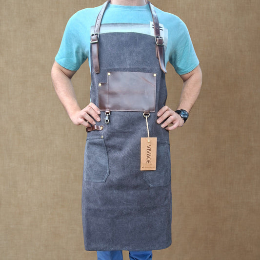 Vivace heavy-duty waxed cotton apron with leather detail worn by model