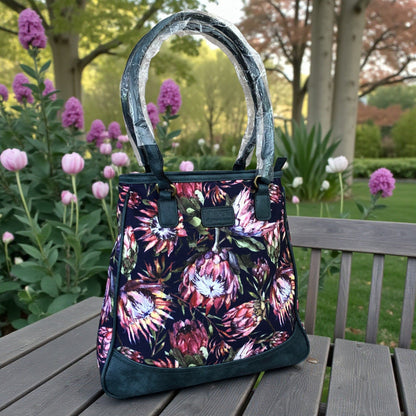Vivace blue Protea canvas handbag front view on table