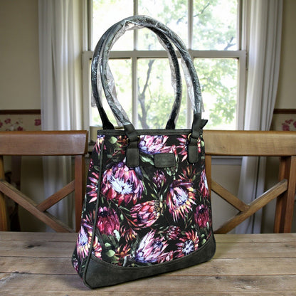 Vivace green Protea canvas handbag front view on table