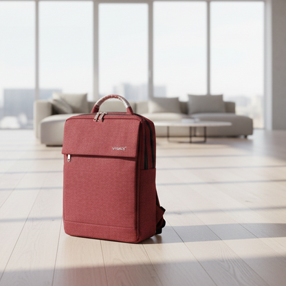 Red suitcase on a wooden floor with large windows in the background