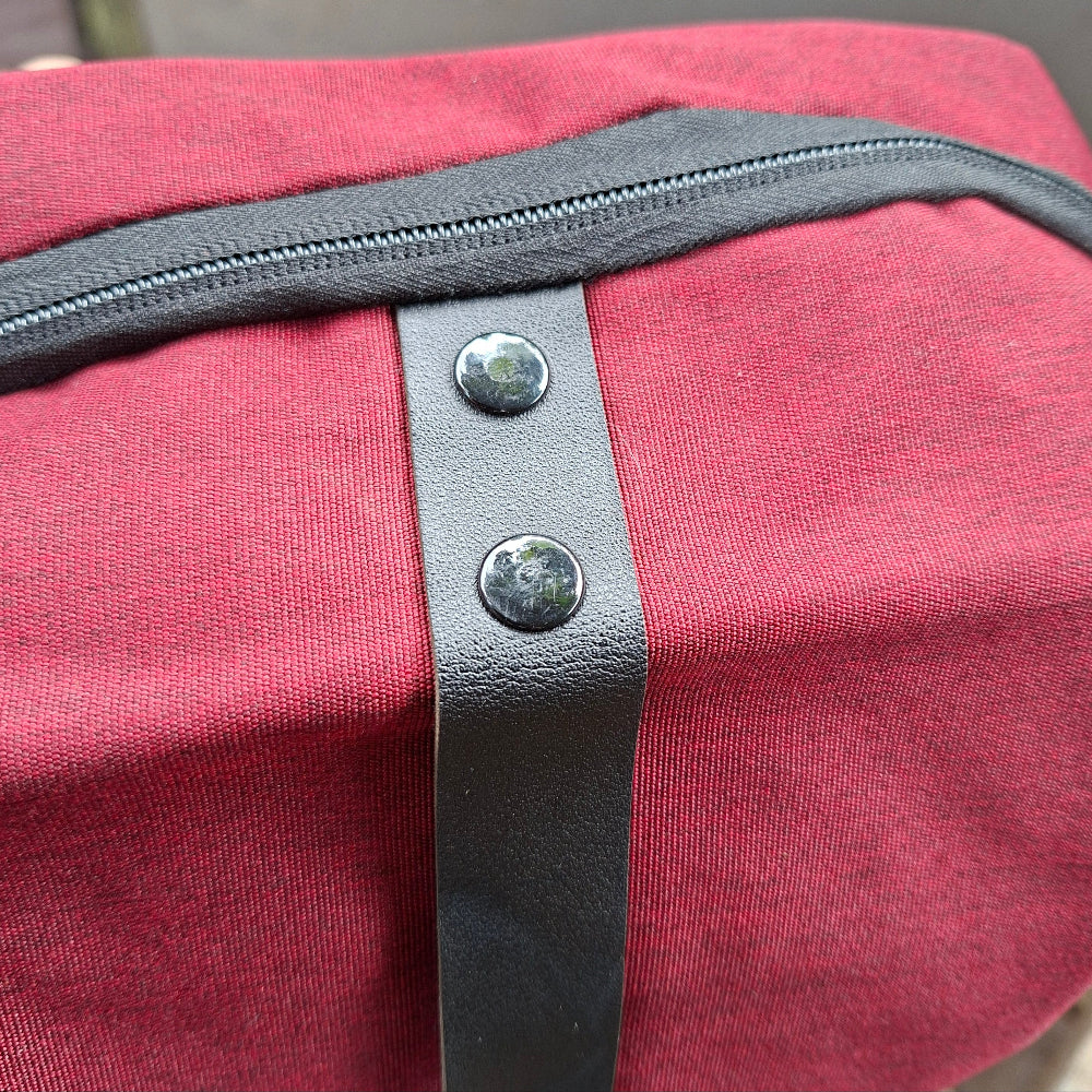 Vivace red canvas laptop backpack detailing view. 