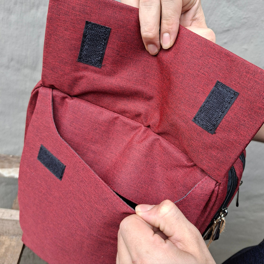 Red Vivace Laptop Backpack front pocket open view. 