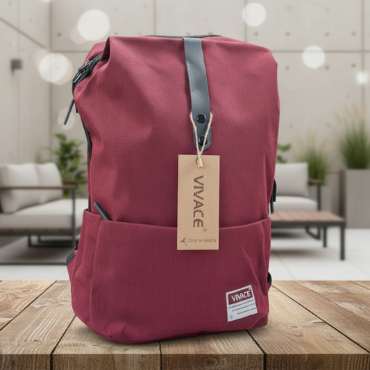 Red backpack with a 'Vivace' tag on a wooden surface with a floral background