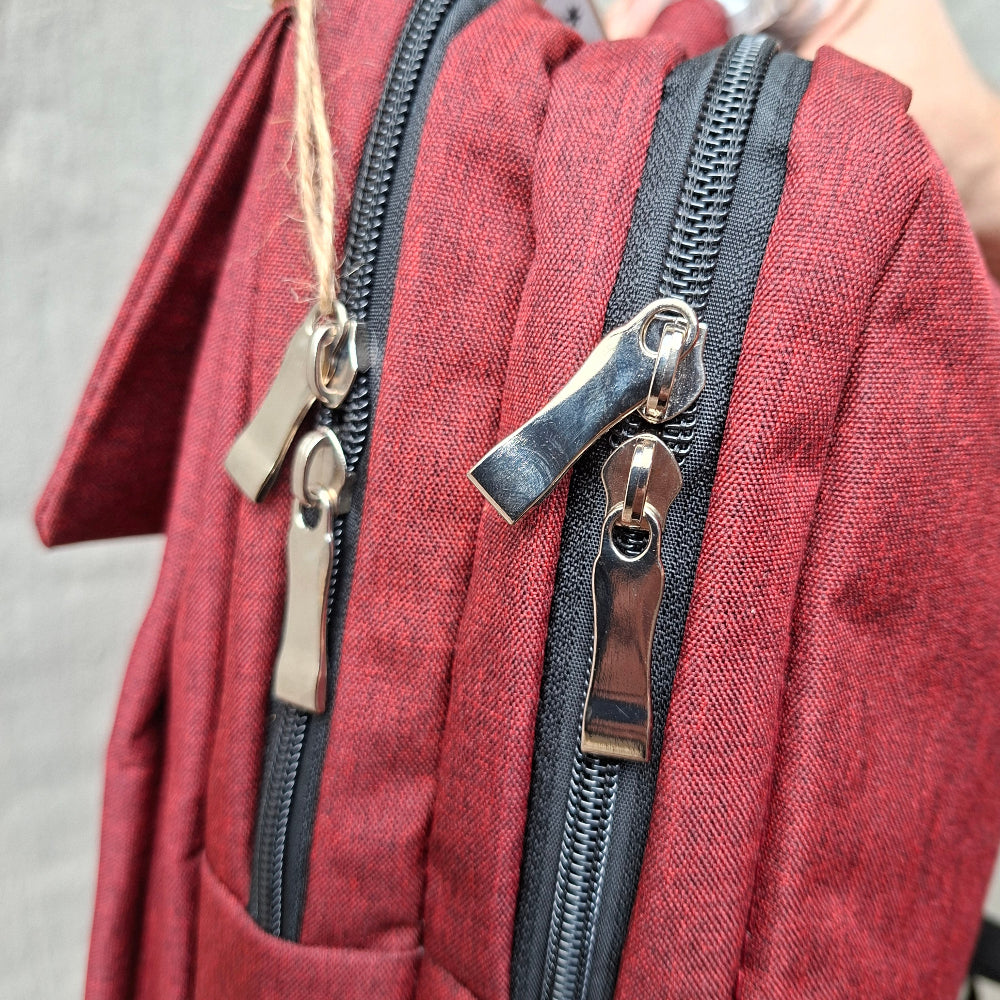 Red Vivace Laptop Backpack side ipper view. 