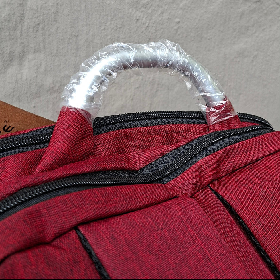 Red Vivace Laptop Backpack top carry handle view. 