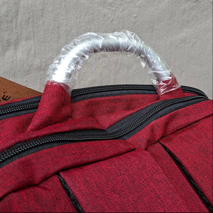 Red Vivace Laptop Backpack top carry handle view. 