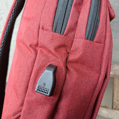 Red Vivace Laptop Backpack with USB port side view. 