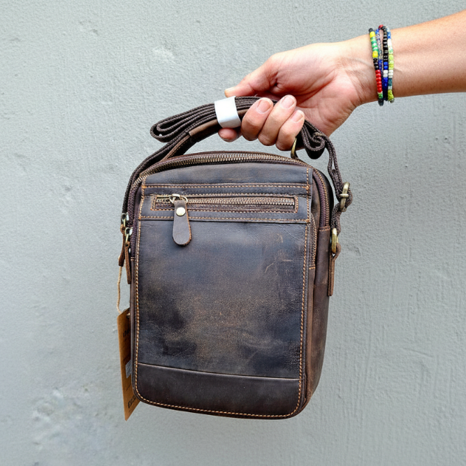 Vivace dark coffee sling bag in hand